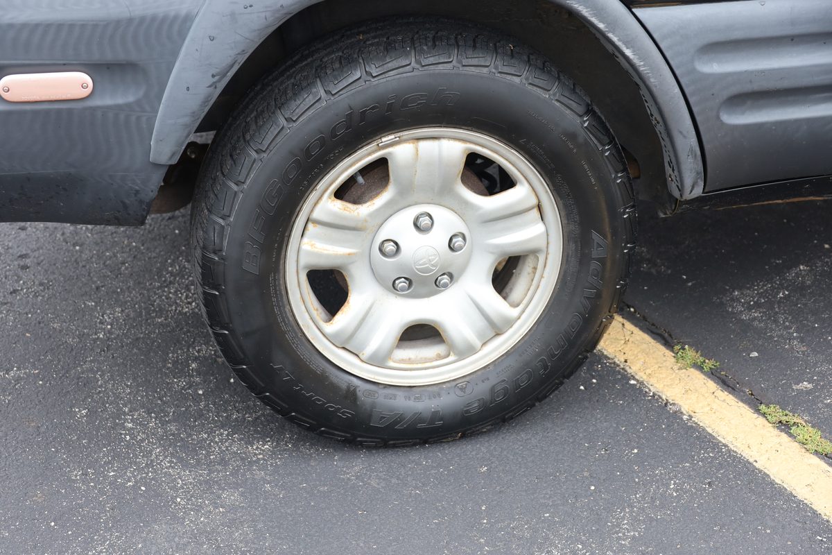 Front alloy wheel and tire close-up